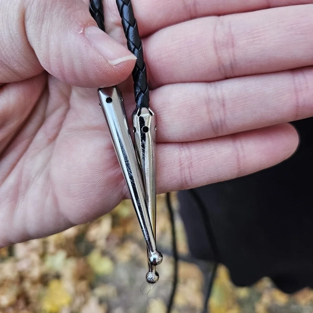 silver tone enamel thunderbird bolo tie on black leather cord